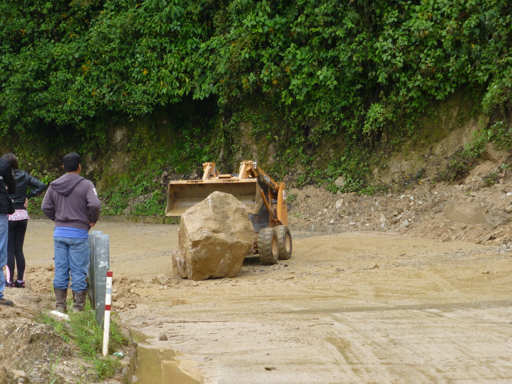 Clearing boulders on the road to Quito
