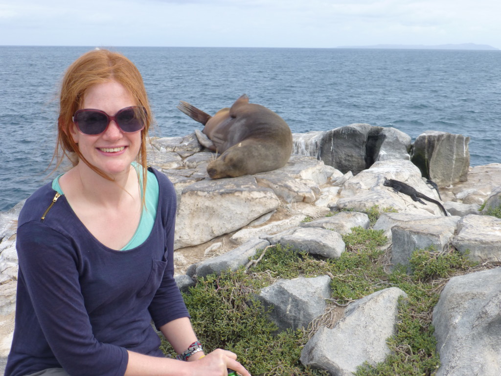 Alex posing with a Sea Lion and Marine Iguana