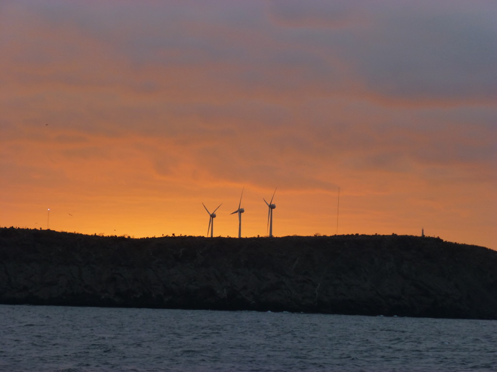 Sunset over the wind turbines on Baltra