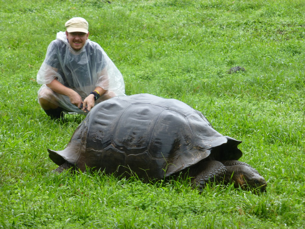 Chris with a giant tortoise in the rain