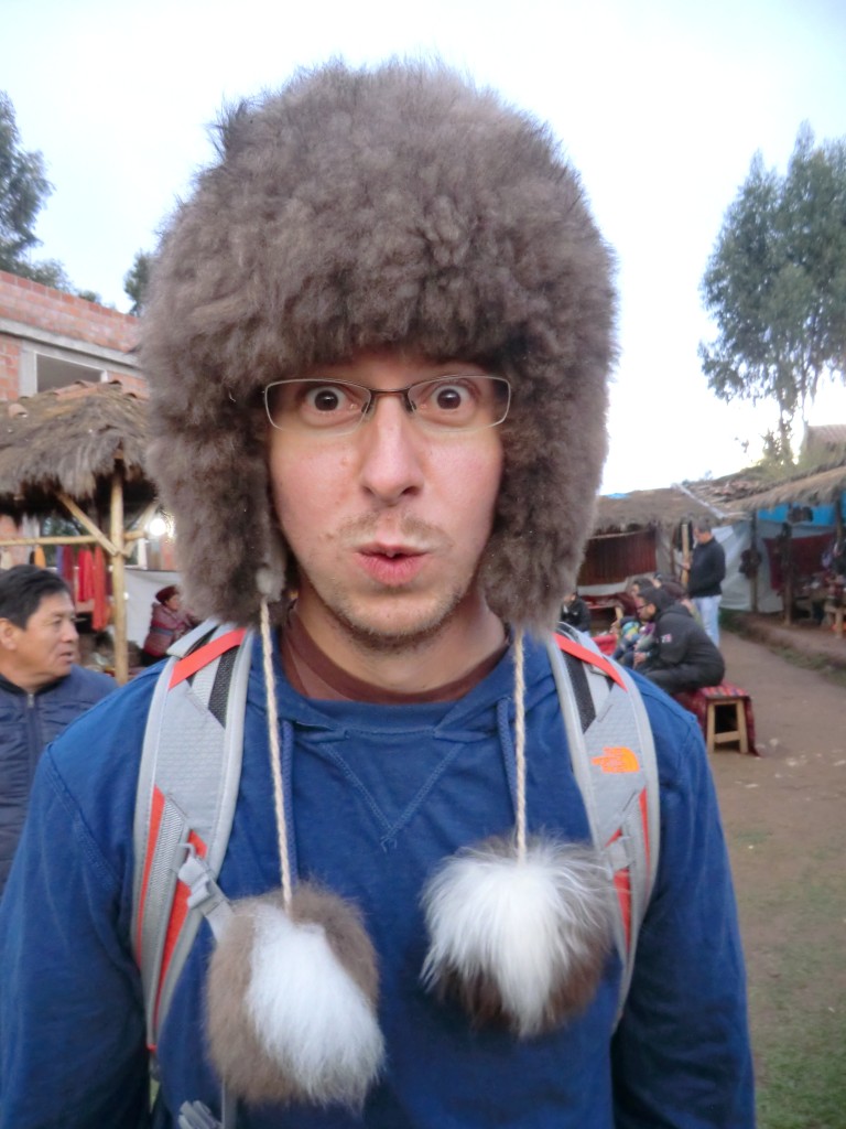 Chris trying on hats in Chinchero