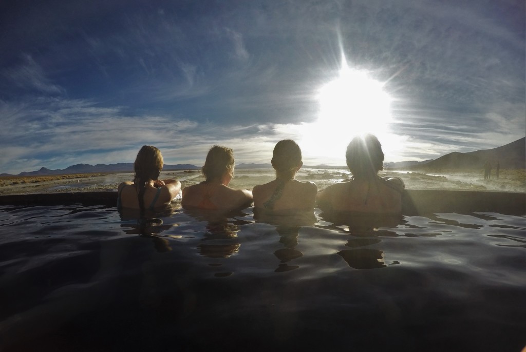 The girls stare out into the desert