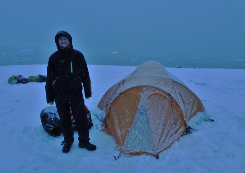 Chris by our tent ready for our night on Antarctica