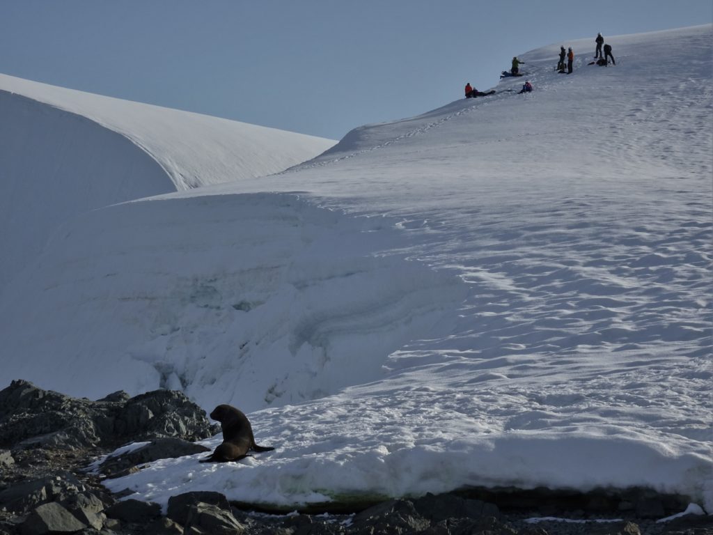 Climbers viewed from the sea