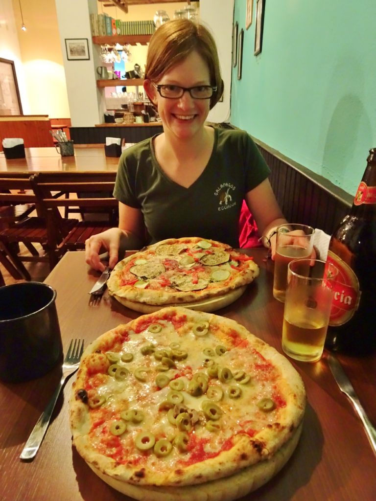 Enjoying pizza and beer