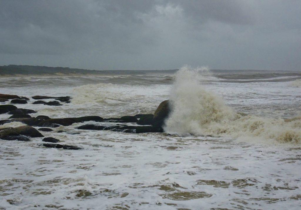 The waves crashing in