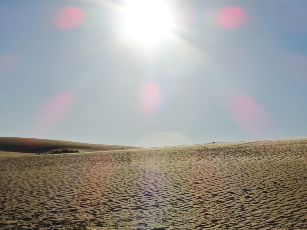 Sun over the sand dunes at Cabo