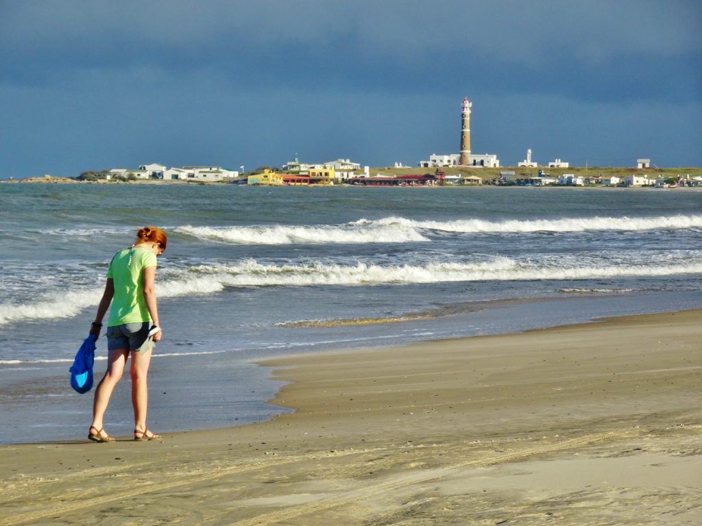 Alex on the beach with Cabo lighthouse in the background