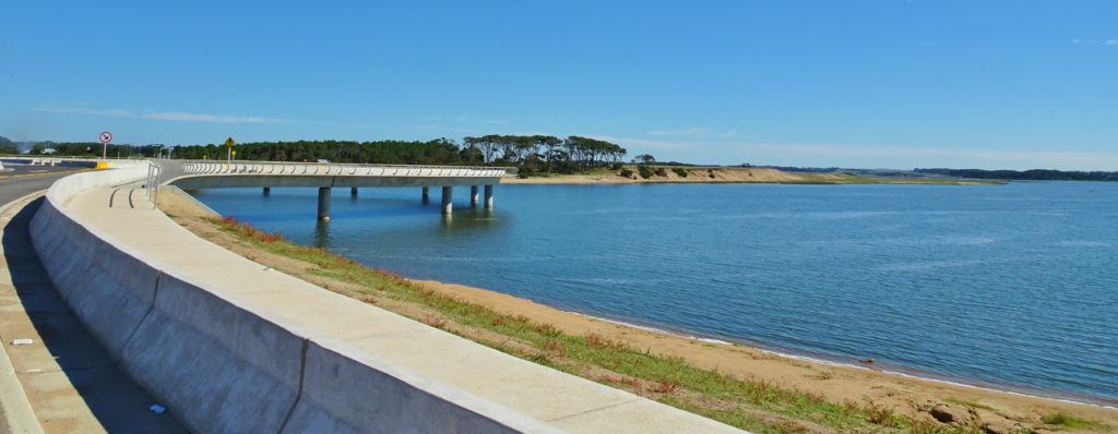 A circular bridge construction over a lagoon